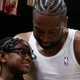 Dwyane Wade #3 of the Miami Heat hugs his son, Zion Wade, after his final career home game at American Airlines Arena on April 9, 2019, in Miami.